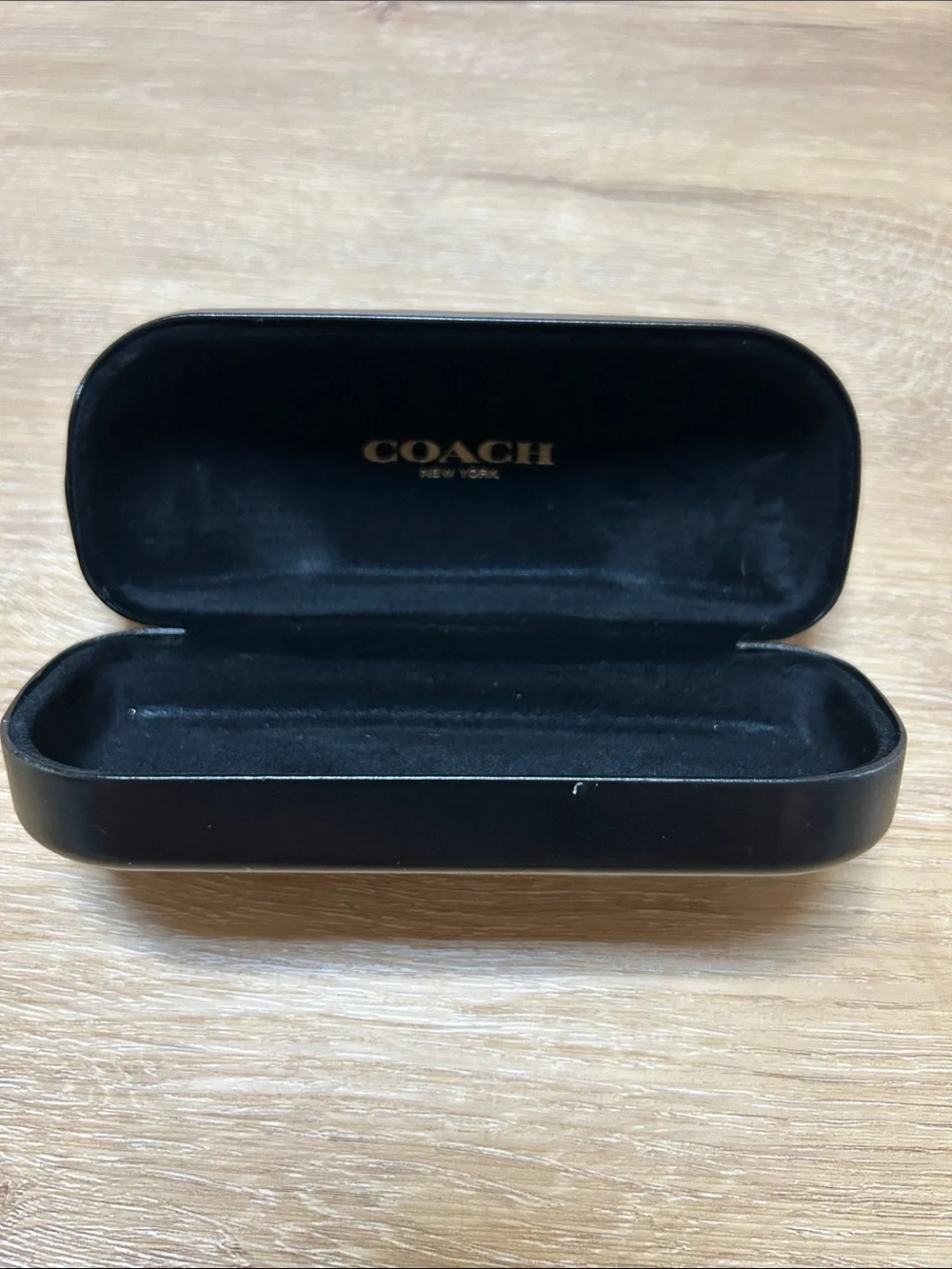 Coach sleek black